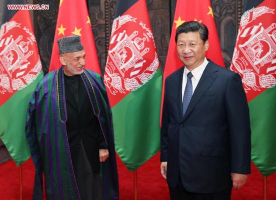 Chinese President Xi Jinping (R) meets with Afghan President Hamid Karzai in Shanghai, east China, May 19, 2014. (Xinhua/Yao Dawei) 