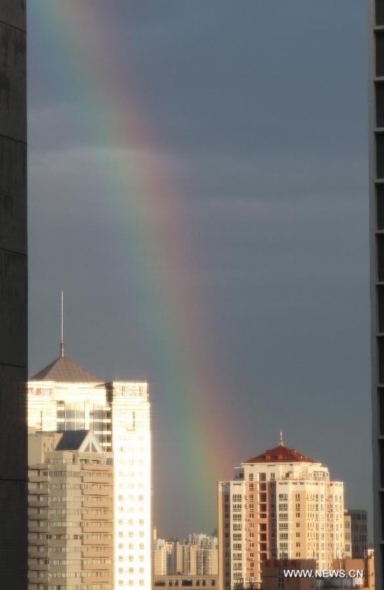 Rainbow appears after hours of rainfalls in Beijing, capital of China, June 6, 2014.