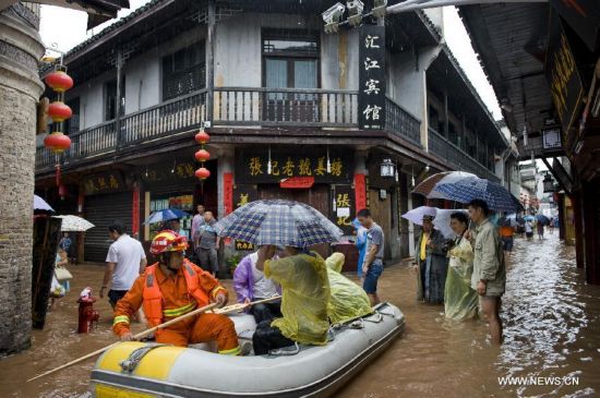 More than 120,000 locals and tourists have been evacuated since Monday night as record downpours hit Fenghuang County, a tourist destination renowned for its ancient town. 