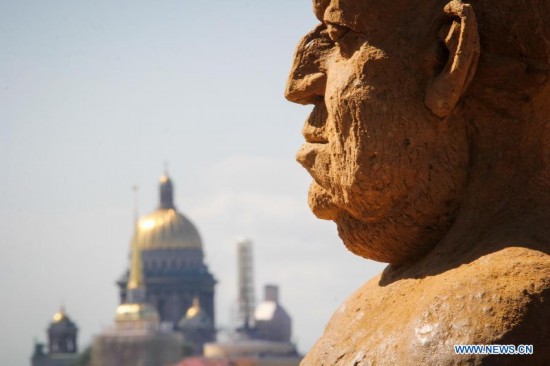 Photo taken on July 17, 2014 shows a sand sculpture displayed during the international festival of sand sculptures in St.Petersburg, Russia. 