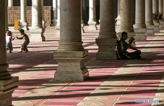 Egyptian children have fun inside a mosque during their fasting hours in a Ramadan afternoon in Cairo June 29, 2014.