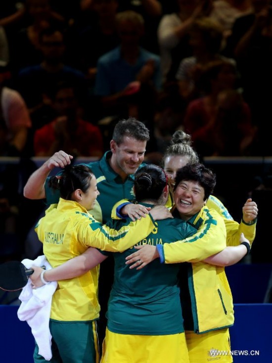 Players of Australia celebrate their vicoty over India after winning the women's team bronze medal match of table tennis at the 2014 Glasgow Commonwealth Games 