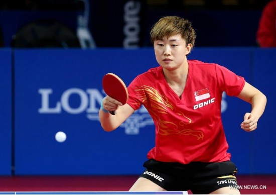 Feng Tianwei of Singapore competes during the women's team final of table tennis against Malaysia's Beh Lee Wei at the 2014 Glasgow Commonwealth Games 