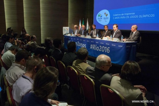 Delegates attend a press conference marking the two-year countdown of the opening of Rio 2016 Olympic Games in Rio de Janeiro, Brazil, Aug. 4, 2014.