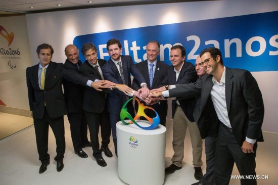 Delegates attend a ceremony marking the two-year countdown of the opening of Rio 2016 Olympic Games in Rio de Janeiro, Brazil, Aug. 4, 2014. 