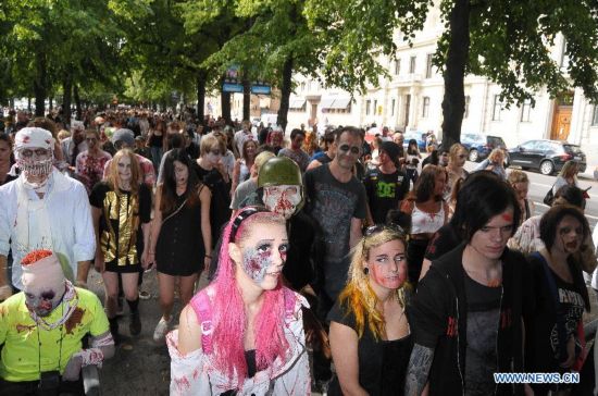 People dressed as zombies take part in a Zombie Walk in Stockholm, Sweden, on Aug.16, 2014.