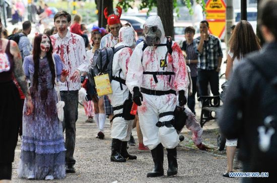 People dressed as zombies take part in a Zombie Walk in Stockholm, Sweden, on Aug.16, 2014.