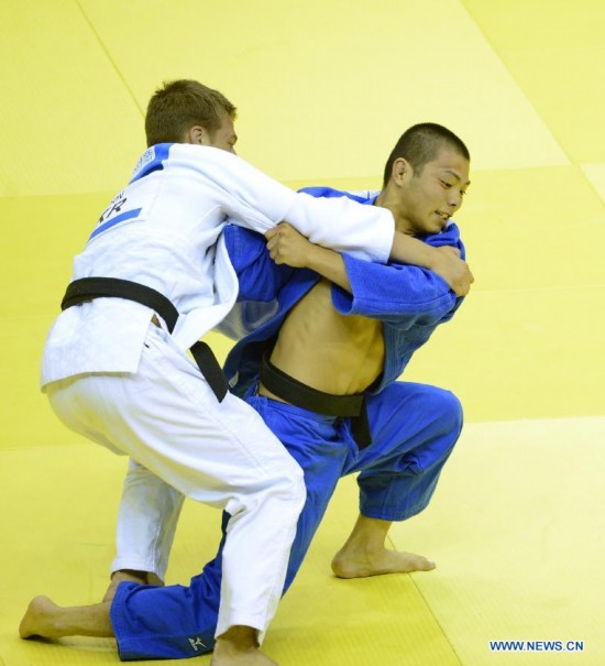 Abe Hifumi of Japan(L) competes with Bogdan Iadov of Ukraine during Men -66 kg of Judo event of Nanjing 2014 Youth Olympic Games 