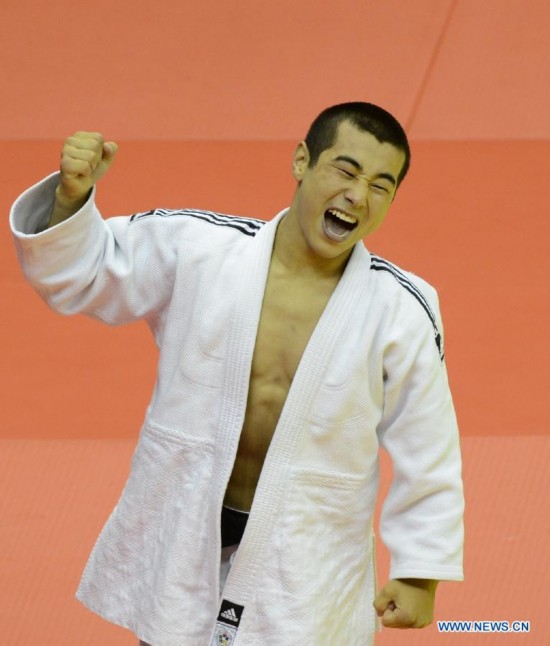 Bauyrzhan Zhauyntayev of Kazakhstan celebrates after Men -55 kg of Judo event of Nanjing 2014 Youth Olympic Games