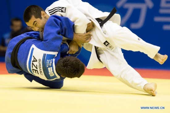 Bauyrzhan Zhauyntayev of Kazakhstan(Top) competes with Natig Gurbanli of Azerbaijan during Men -55 kg of Judo event of Nanjing 2014 Youth Olympic Games