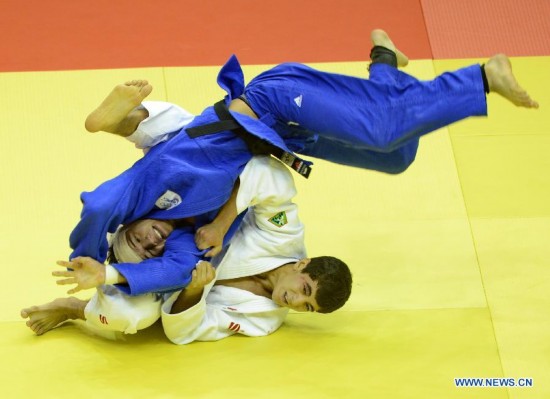 Sukhrob Tursunov of Uzbekistan(Bottom) competes during Men -66 kg of Judo event of Nanjing 2014 Youth Olympic Games