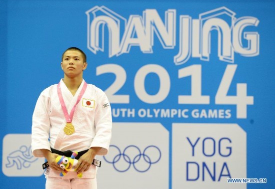 Abe Hifumi of Japan(L) poses after Men -66 kg of Judo event of Nanjing 2014 Youth Olympic Games 