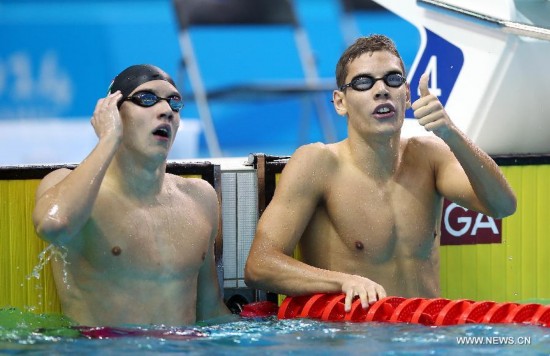 Benjamin Gratz (R) of Hungary reacts after the men's 200m individual medley swimming event of Nanjing 2014 Youth Olympic Games