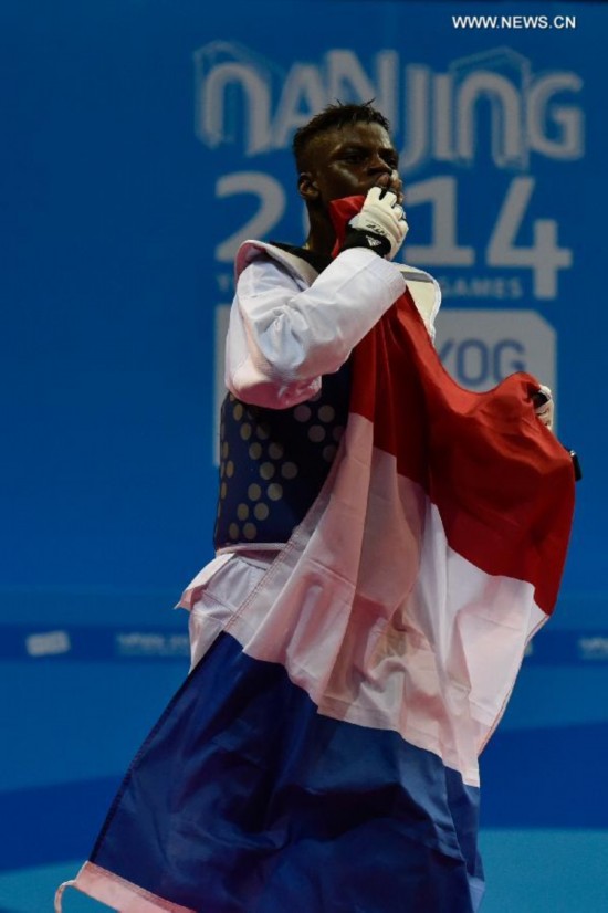 Yoann Miangue of France celebrates after the men+73kg final of Taekwondo event during Nanjing 2014 Youth Olympic Games in Nanjing, capital of east China’s Jiangsu Province, on Aug. 21, 2014. 