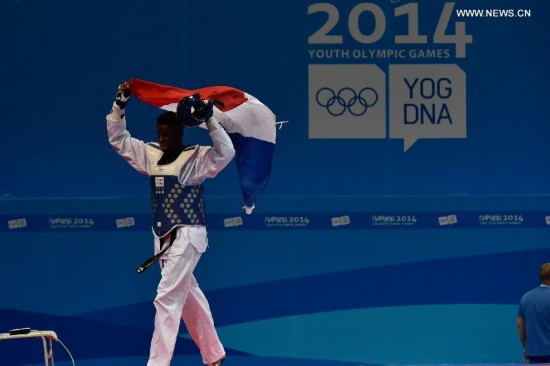 Yoann Miangue of France celebrates after the men+73kg final of Taekwondo event during Nanjing 2014 Youth Olympic Games in Nanjing, capital of east China’s Jiangsu Province, on Aug. 21, 2014.