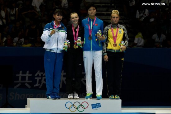 Gold medalist Kendall Yount(2nd, L) of the United States, silver medalist Umida Abdullaeva(1st, L) of Uzbekistan, bronze medalist Li Chen(2nd, R) of China and Yuliia Miiuts of Ukraine pose during the awarding ceremony of the Women +63kg final of Taekwondo at the Nanjing 2014 Youth Olympic Games in Nanjing, capital of east China's Jiangsu Province, on August 21, 2014.