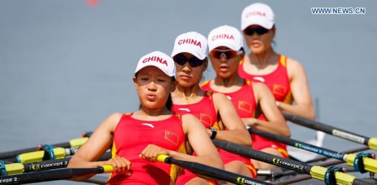 Zhang Xinyue, Wang Yuwei, Shen Xiaoxing and Wang Min (L to R) of China compete during the women's quadruple sculls final of rowing at the 17th Asian Games in Chungju, South Korea, Sept. 25, 2014. China won the gold medal.