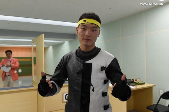 Zhai Yujia of China celebrates after the 10m running target men's gold medal competition of shooting at the 17th Asian Games in Incheon, South Korea, Sept. 25, 2014. Zhai Yujia won the gold medal.