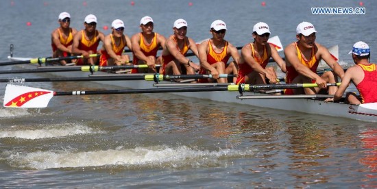 Athletes of China compete during the men's eight final of rowing at the 17th Asian Games in Chungju, South Korea, Sept. 25, 2014. China won the gold medal.