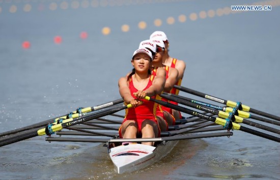 Zhang Xinyue, Wang Yuwei, Shen Xiaoxing and Wang Min (L to R) of China compete during the women's quadruple sculls final of rowing at the 17th Asian Games in Chungju, South Korea, Sept. 25, 2014. China won the gold medal.