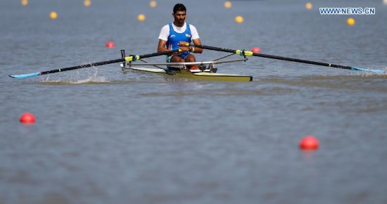 Shadinaghadeh Mohsen of Iran competes during the men's single sculls of rowing at the 17th Asian Games in Incheon, South Korea, Sept. 25, 2014. Shadinaghadeh Mohsen won the gold medal with 7 minutes and 05.66 seconds.