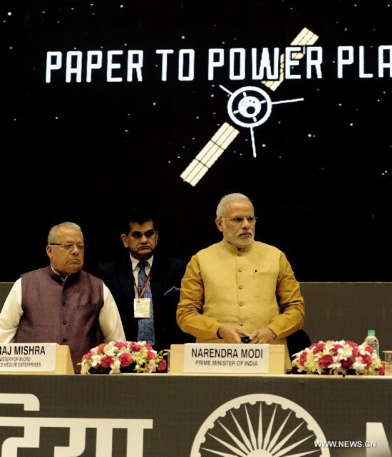 Indian Prime Minister Narendra Modi (R) attends the launch of his 'Make in India' initiative prior to his scheduled departure to the United States in New Delhi, India, Sept. 25, 2014.