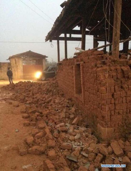 Photo taken with a mobile phone shows the damaged house in Mangfei Village of Yongping Township at Jinggu County of Pu'er City, southwest China's Yunnan Province, Oct. 8, 2014.