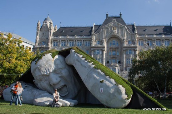 A giant sculpture titled 'Pop Up' by Ervin Herve-Loranth of Hungary is seen on Szechenyi Square in Budapest, Hungary, on Oct. 14, 2014.