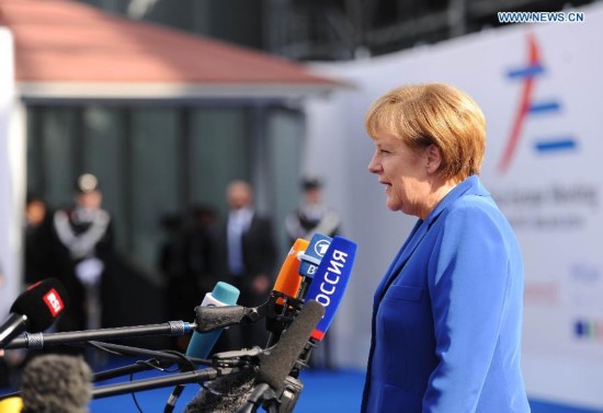 German Chanceller Angela Merkel speaks to the media before the Asia-Europe Meeting (ASEM) in Milan, Italy on October 16,2014. The tenth Asia-Europe Meeting (ASEM) opened in Milan on Thursday under the theme of 'Responsible Partnership for Growth and Security.'L