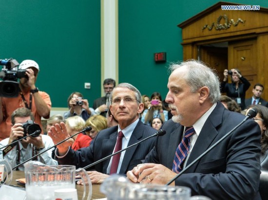 Anthony Fauci(L), director of the National Institute of Allergy and Infectious Diseases, part of the National Institutes of Health (NIH) testifies during a hearing on Examining the U.S. Public Health Response to the Ebola Outbreak before the Oversight and Investigations Subcommittee at Capitol Hill in Washington D.C., capital of the United States, Oct. 16, 2014. A hospital in Texas where an Ebola patient died and two nurses were infected apologized Thursday for mishandling the deadly disease, as the National Institutes of Health (NIH) prepared to treat the first nurse who contracted the virus while caring for the deceased.