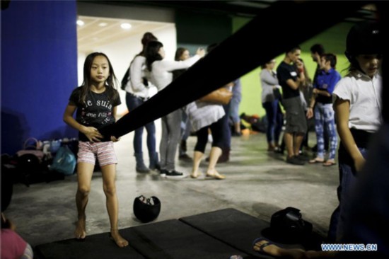 Chinese girl in local Spanish human tower team