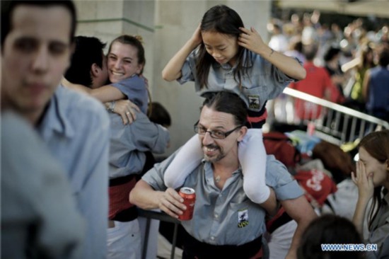 Chinese girl in local Spanish human tower team