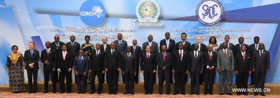 Handout photo from Egypt's state-run news agency MENA shows that Egyptian President Abdel-Fattah al-Sisi (8th R, front) and African country leaders as well as the World Bank President Jim Yong Kim (2nd L) pose for photo at the Tripartite summit for the Common Market of Eastern and Southern Africa (COMESA), the East African Community (EAC) and the Southern African Development Community (SADC), held in Egypt's Red Sea resort city Sharm El-Sheikh, on June 10, 2015.