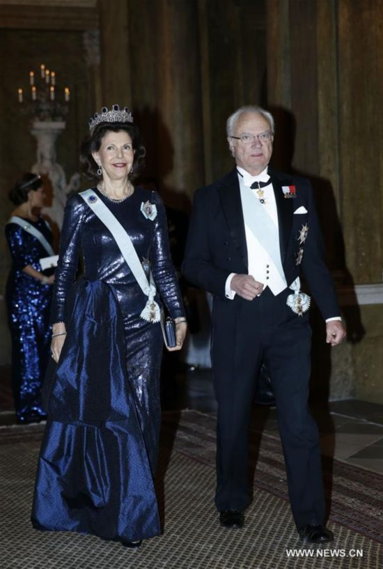 Sweden's King Carl XVI Gustaf and Queen Silvia attend the royal banquet for Nobel laureates at Royal Palace in Stockholm, Sweden, Dec. 11, 2015.