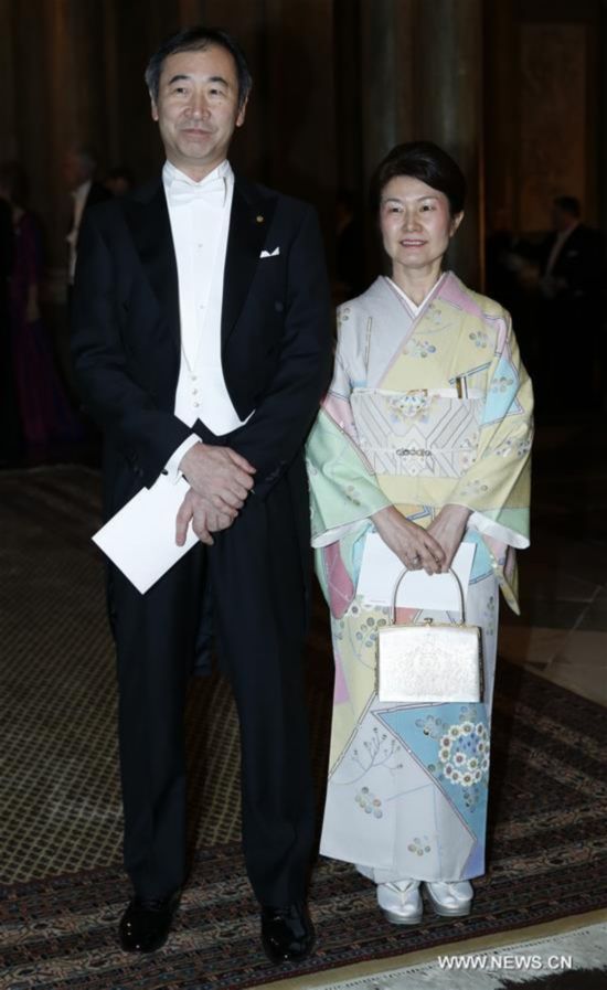 Nobel Prize in Physics 2015 laureate, Japanese physicist Takaaki Kajita (L), attends the royal banquet for Nobel laureates at Royal Palace in Stockholm, Sweden, Dec. 11, 2015. 