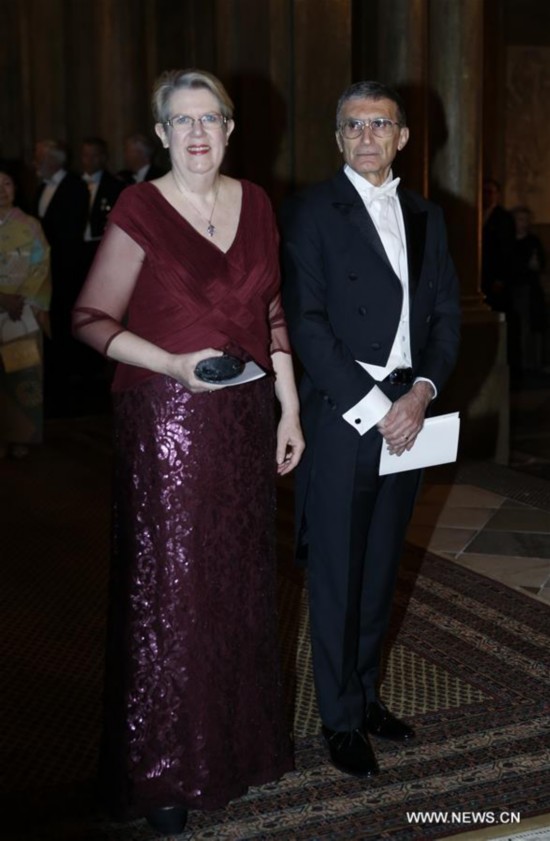 Nobel Prize in Chemistry 2015 laureate Aziz Sancar (R) attends the royal banquet for Nobel laureates at Royal Palace in Stockholm, Sweden, Dec. 11, 2015.