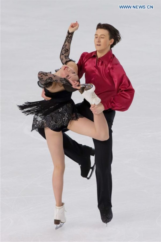 Gold medalists Lorraine McNamara (L) and Quinn Carpenter of the United States compete during the Ice Dance competition at the ISU World Junior Figure Skating Championships in Debrecen, Hungary, March 19, 2016. 