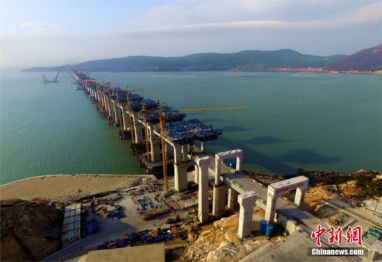 China's first cross-sea rail-road bridge takes shape