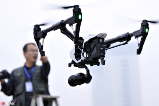 An unmanned aerial vehicle (UAV), or drone, hovers in Linyi city, east China's Shandong province, 9 April 2016.[Photo: IC]