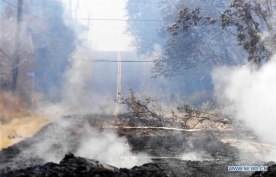 Volcanic debris are seen on a road in Leilani Estate, Hawaii, U.S., May 9, 2018. According to reports of the Hawaii State government, eruptions of the Kilauea Volcano had forced the evacuation of thousands of people. [Photo: Xinhua/Tao Xiyi]