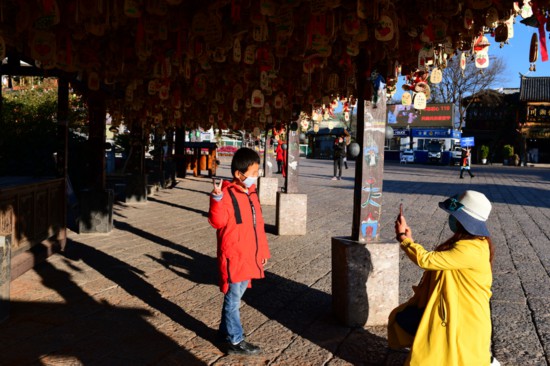 麗江古城的游客 麗江市文化和旅游局供圖