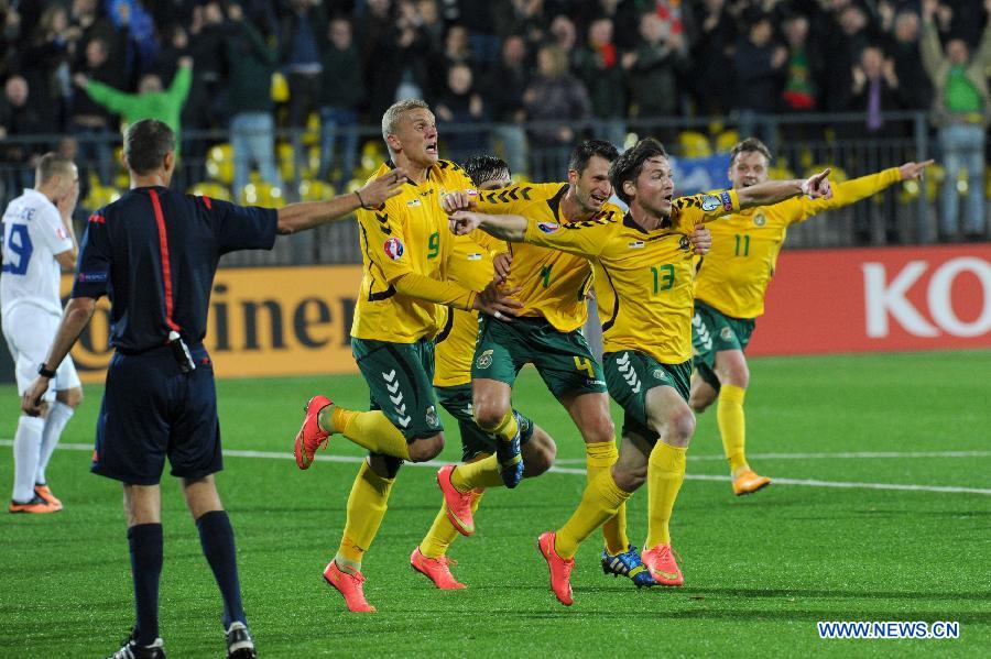 Lithuania's players celebrate the team's scoring during the Euro 2016 Qualifier football match against Estonia in Vilnius, Lithuania, on Oct. 9, 2014. Lithuanians won 1-0. 