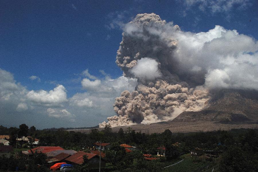 Mount Sinabung spews volcanic ash as it is seen from Jeraya Village, Karo, North Sumatra, Indonesia, October 17, 2014.