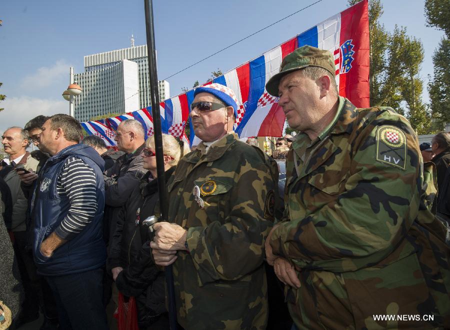 Croatian war veterans protest outside of the War Veterans' Ministry building in Zagreb, capital of Croatia, Oct. 28, 2014. 