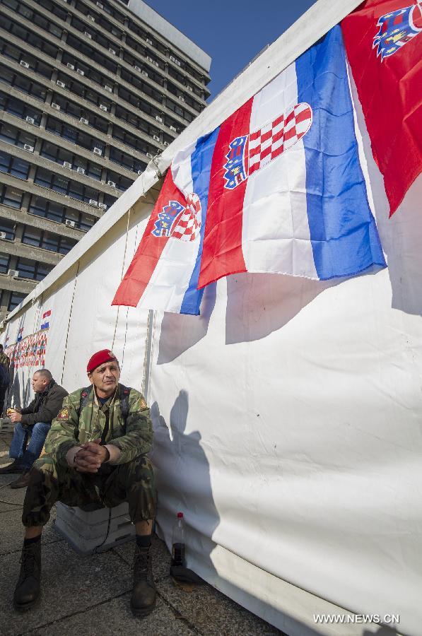 Croatian war veterans protest outside of the War Veterans' Ministry building in Zagreb, capital of Croatia, Oct. 28, 2014.