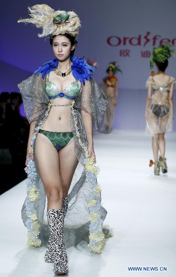 A model presents a creation at the Ordifen underwear design contest during China Fashion Week in Beijing, capital of China, Oct. 29, 2014.