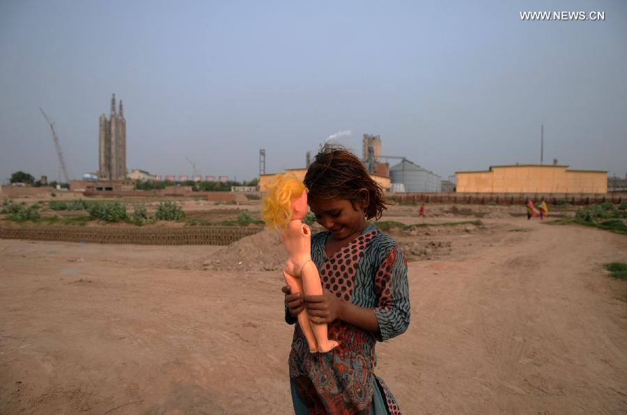 A laborer works at a brick factory in central Pakistan's Multan on Oct. 30, 2014. 