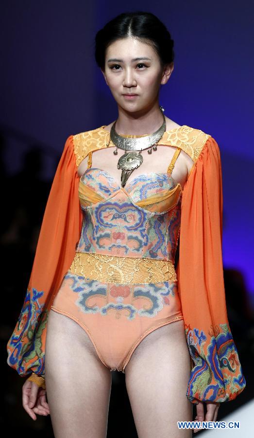 A model presents a creation at the Ordifen underwear design contest during China Fashion Week in Beijing, capital of China, Oct. 29, 2014.