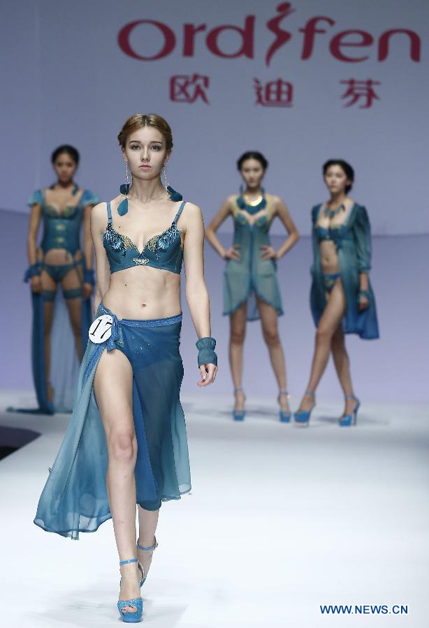 A model presents a creation at the Ordifen underwear design contest during China Fashion Week in Beijing, capital of China, Oct. 29, 2014.