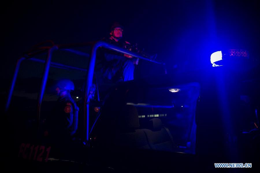 Members of the Civil Force prepare for their night guard in Monterrey, Nuevo Leon, Mexico, on Oct. 29, 2014.